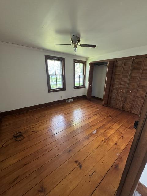 1001 Earl Road Michigan City, IN 46360 - Photo 14 of 24 an empty room with wooden floor and windows