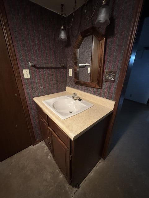 1001 Earl Road Michigan City, IN 46360 - Photo 23 of 24 a utility room with a sink a vanity and wooden floor