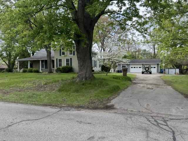 1001 Earl Road Michigan City, IN 46360 - Photo 5 of 24 a white house in front of a big yard with large trees