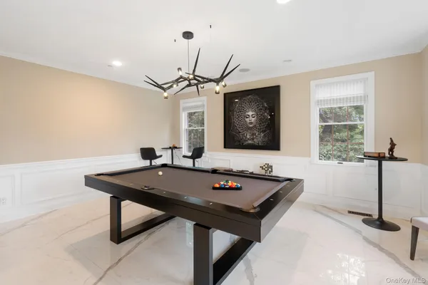 a view of a room with furniture and window