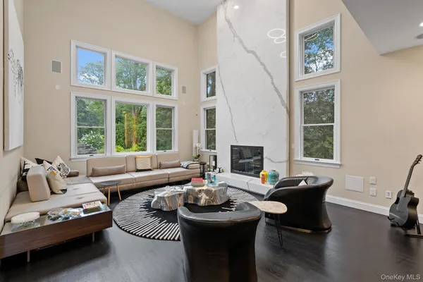 a living room with furniture and a fireplace