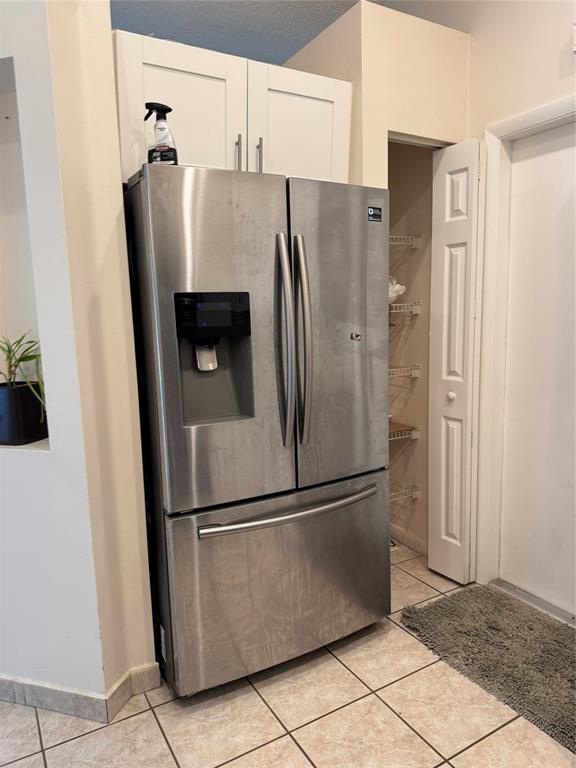 4077 Pine Ridge Lane Weston, FL 33331 - Photo 11 of 25 a metallic refrigerator freezer sitting in a kitchen