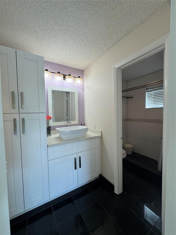 4077 Pine Ridge Lane Weston, FL 33331 - Photo 17 of 25 a bathroom with a sink and a mirror