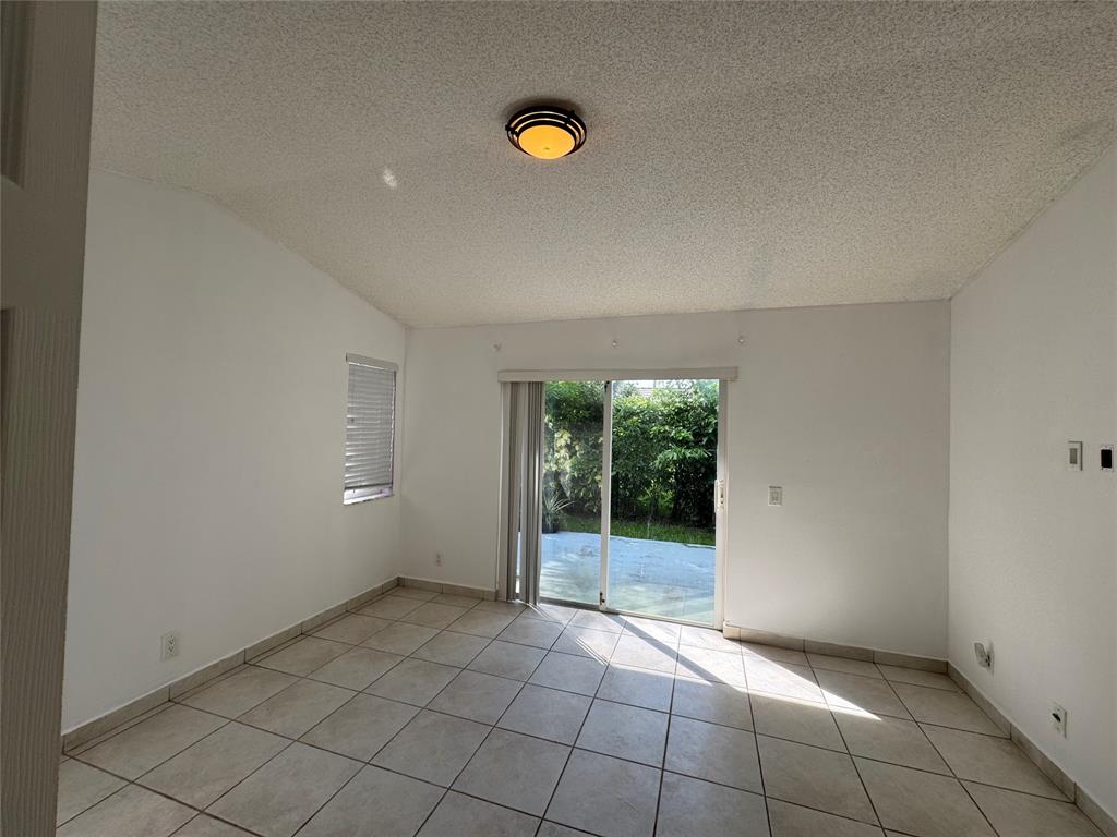 4077 Pine Ridge Lane Weston, FL 33331 - Photo 20 of 25 a view of an empty room and window