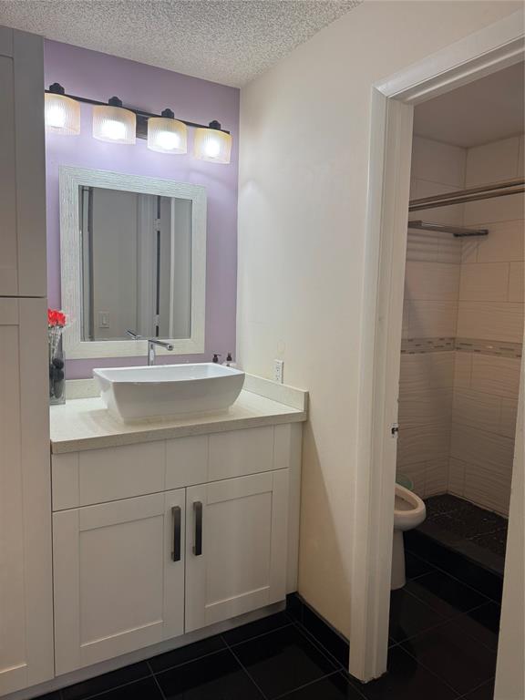 4077 Pine Ridge Lane Weston, FL 33331 - Photo 7 of 25 a bathroom with a sink and a mirror