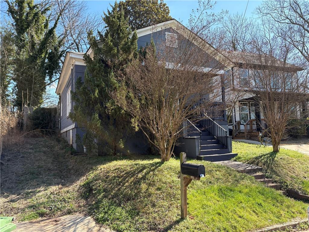1154 Welch Street Southwest Atlanta, GA 30310 - Photo 2 of 7 a view of a yard with plants and large trees