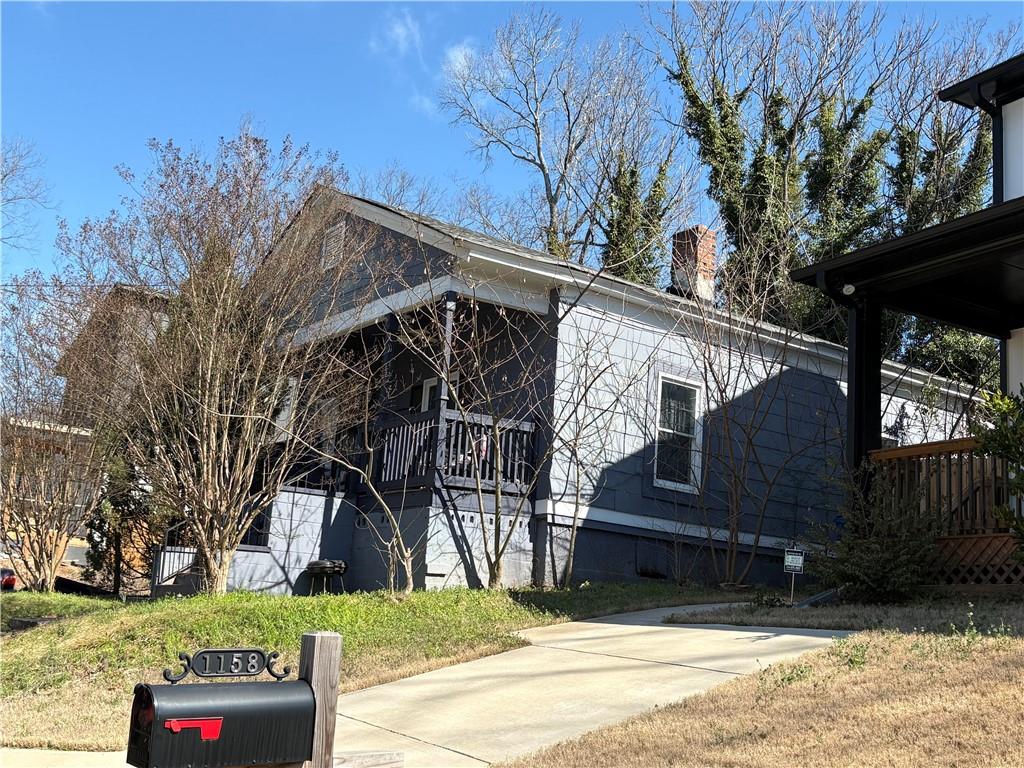 1154 Welch Street Southwest Atlanta, GA 30310 - Photo 3 of 7 a view of a house with a yard