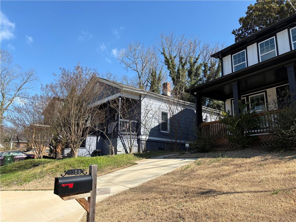 1154 Welch Street Southwest Atlanta, GA 30310 - Photo 4 of 7 a view of a house with a yard