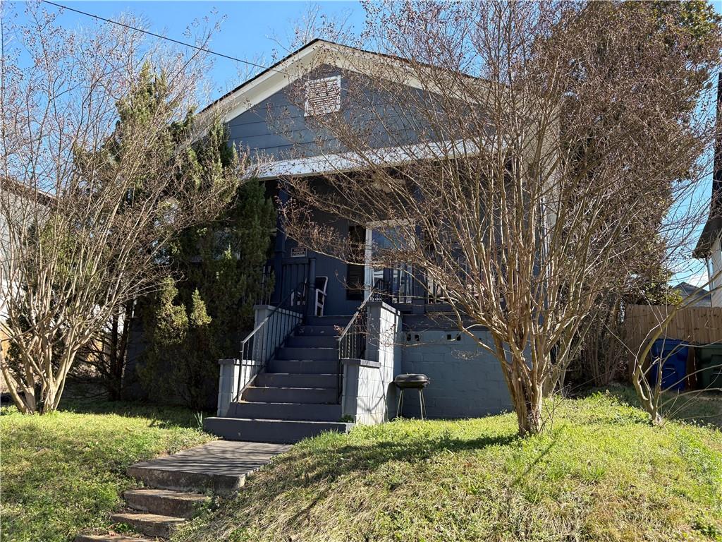 1154 Welch Street Southwest Atlanta, GA 30310 - Photo 5 of 7 a view of a house with a yard