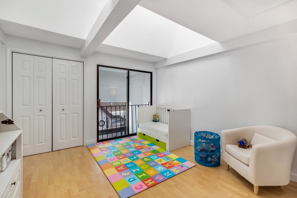 12 Locust Street, Unit 3D Everett, MA 02149 - Photo 16 of 24 a very nice looking room with a big bed