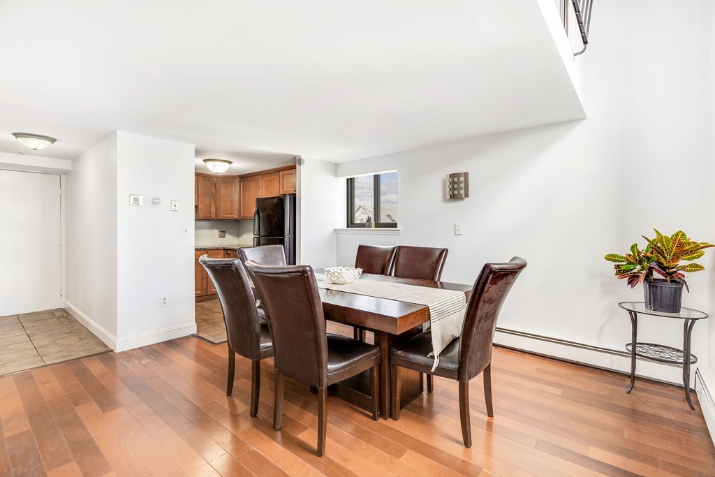 12 Locust Street, Unit 3D Everett, MA 02149 - Photo 7 of 24 a view of a dining room with furniture and wooden floor