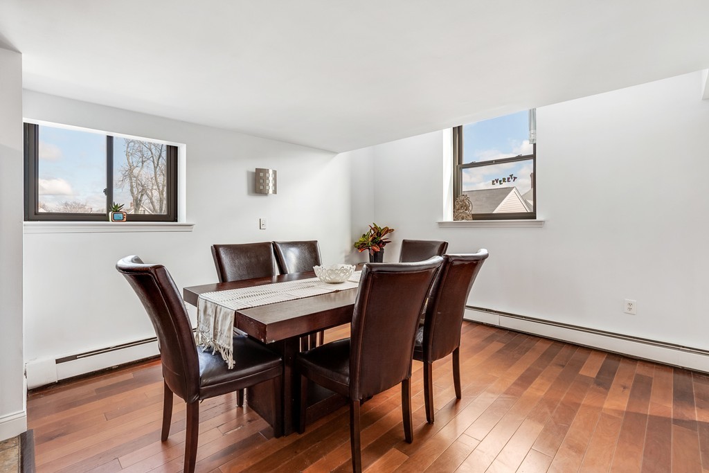 12 Locust Street, Unit 3D Everett, MA 02149 - Photo 8 of 24 a view of a dining room with furniture and wooden floor