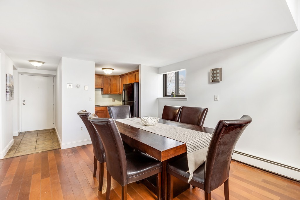 12 Locust Street, Unit 3D Everett, MA 02149 - Photo 9 of 24 a view of a dining room with furniture and wooden floor