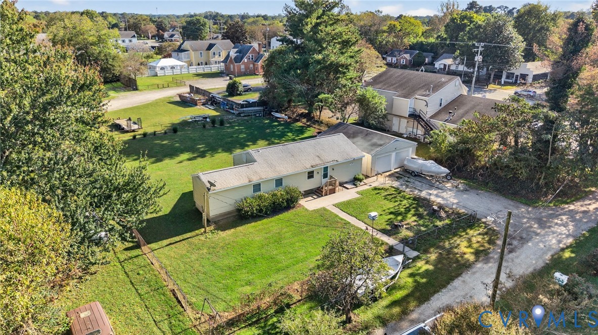 an aerial view of residential houses with outdoor space