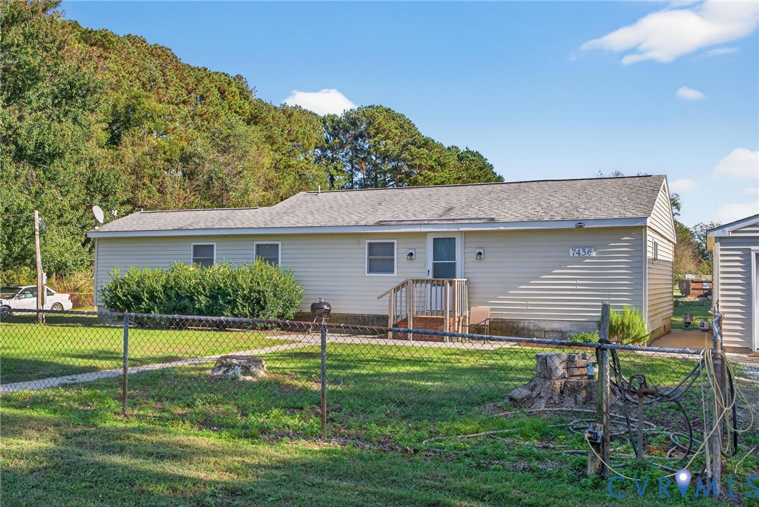 7436 Richmond Road Williamsburg, VA 23188 - Photo 17 of 44 a view of a house with a yard and a garden