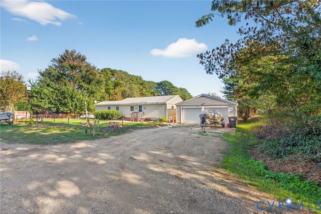 7436 Richmond Road Williamsburg, VA 23188 - Photo 18 of 44 a view of a house with a yard and large trees