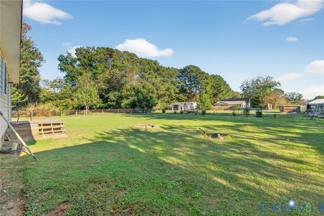 7436 Richmond Road Williamsburg, VA 23188 - Photo 21 of 44 a view of a golf course with a lake view
