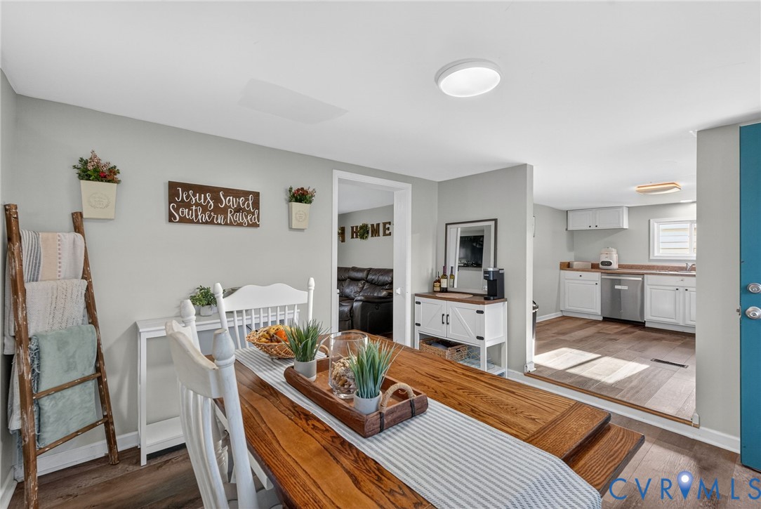7436 Richmond Road Williamsburg, VA 23188 - Photo 25 of 44 a living room with furniture and a wooden floor