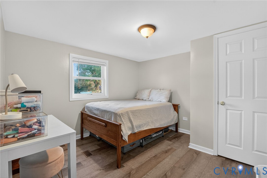 7436 Richmond Road Williamsburg, VA 23188 - Photo 33 of 44 a bedroom with a bed and a window