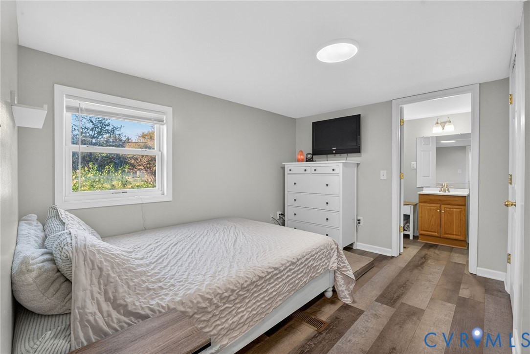 7436 Richmond Road Williamsburg, VA 23188 - Photo 37 of 44 a bedroom with a bed and a television