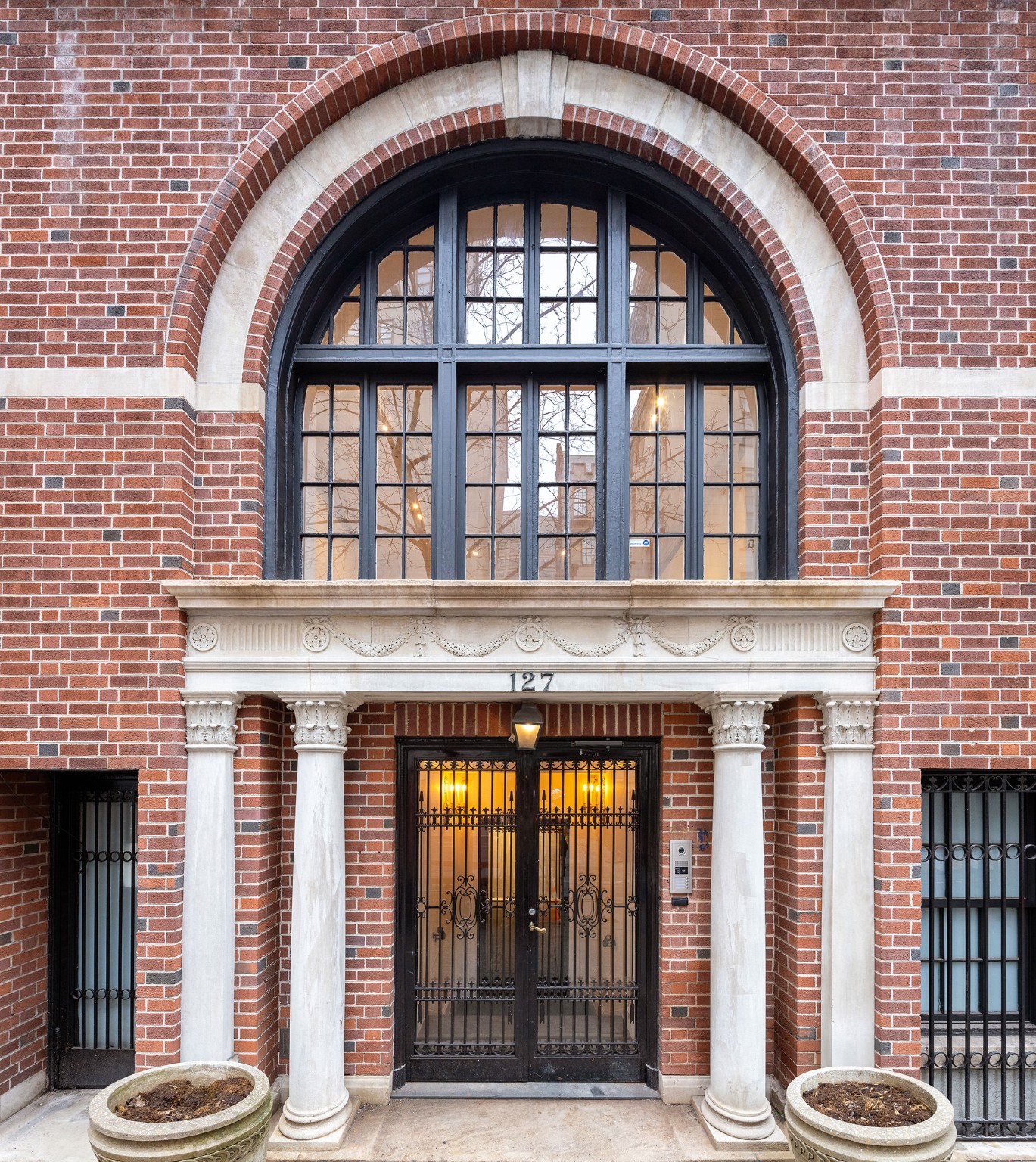 127 East 69th Street, Unit RES 3 Manhattan, NY 10021 - Photo 9 of 10 a front view of a house with a large window