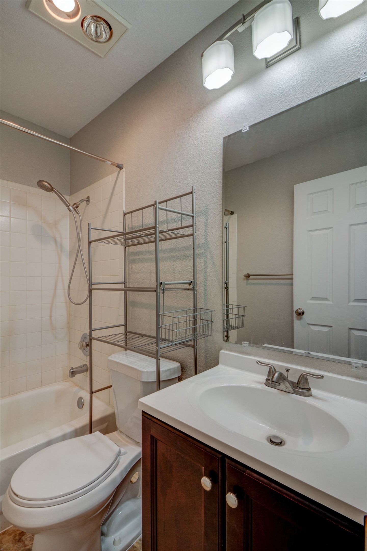 202 South College Street, Unit 9 Georgetown, TX 78626 - Photo 14 of 22 a bathroom with a sink a toilet and shower