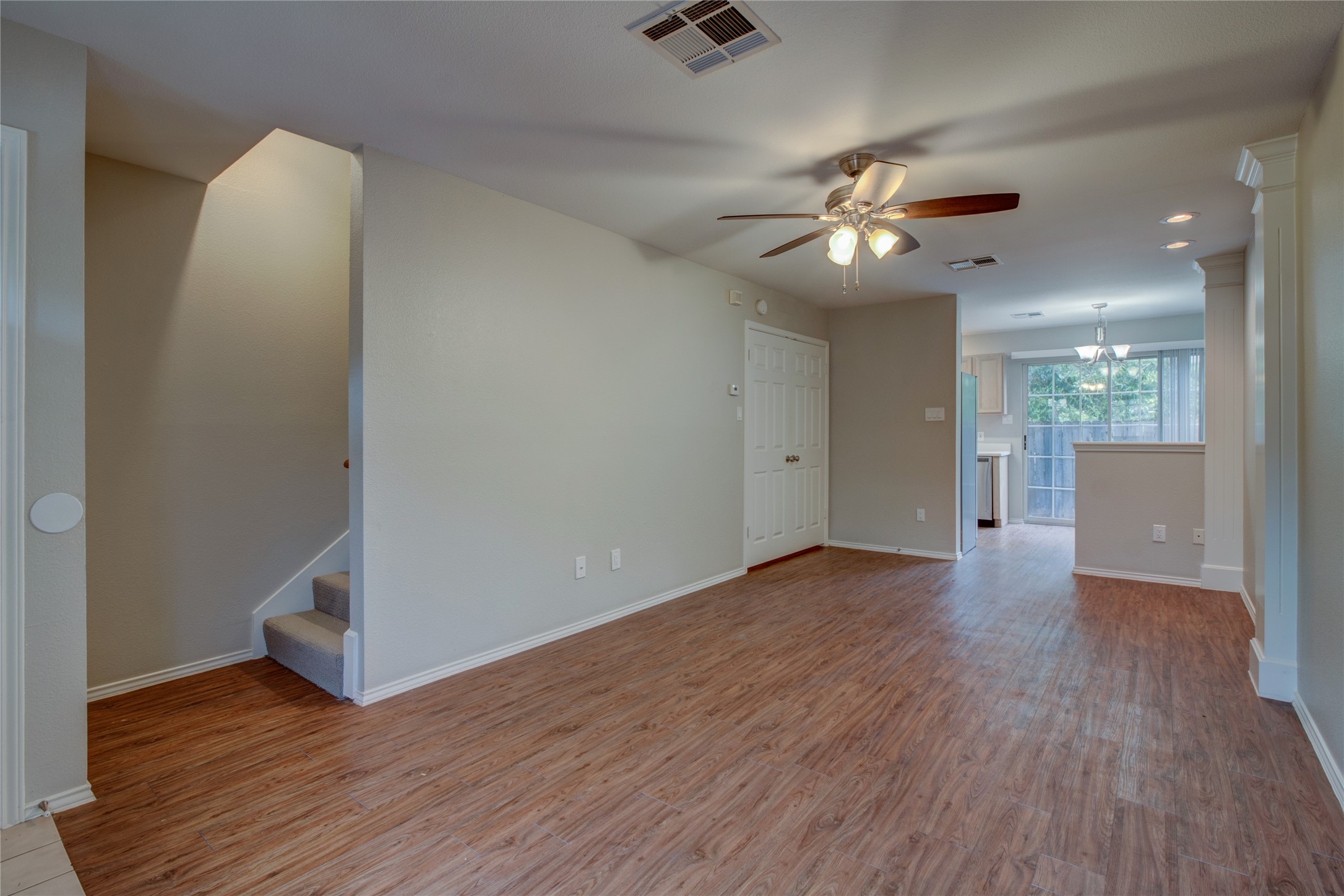 202 South College Street, Unit 9 Georgetown, TX 78626 - Photo 16 of 22 wooden floor in an empty room with a window