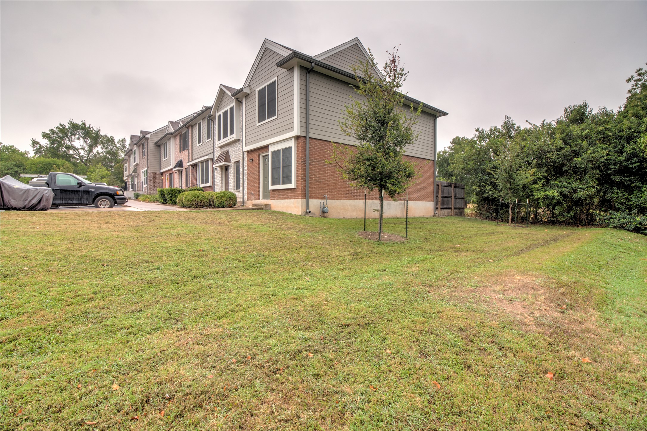 202 South College Street, Unit 9 Georgetown, TX 78626 - Photo 21 of 22 a view of a house with a yard and a garage