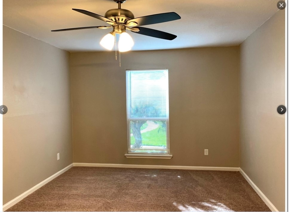 2200 Cypress Landing Road, Unit C12 Houston, TX 77090 - Photo 5 of 12 an empty room with a window and a fan