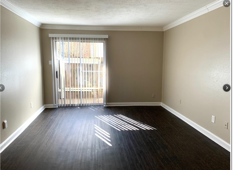 2200 Cypress Landing Road, Unit C12 Houston, TX 77090 - Photo 6 of 12 a view of an empty room with wooden floor and a window