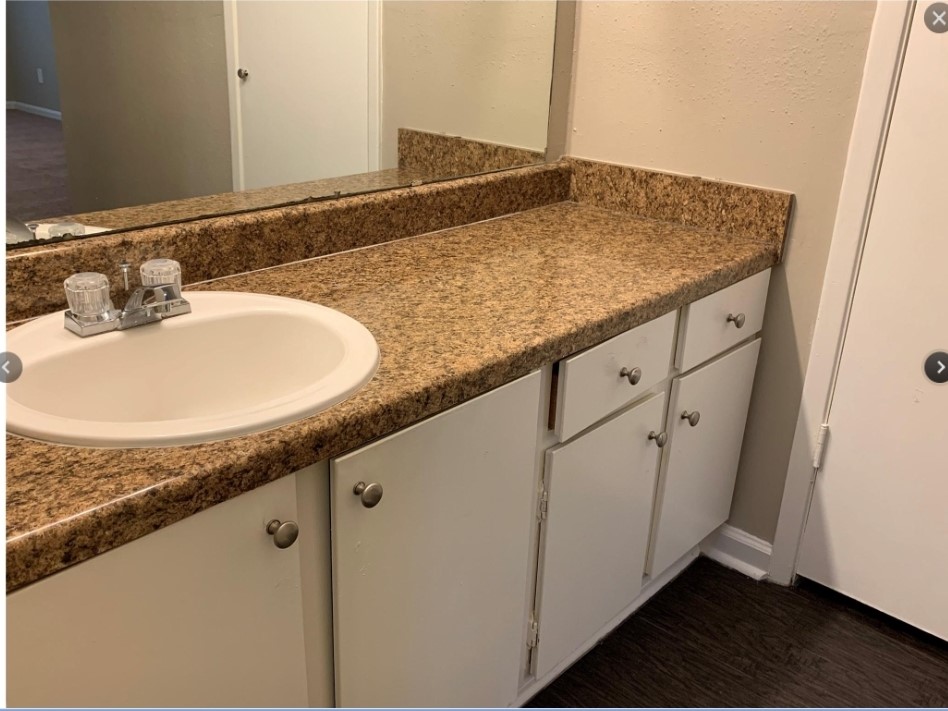 2200 Cypress Landing Road, Unit C12 Houston, TX 77090 - Photo 10 of 12 a bathroom with a granite countertop sink and a mirror