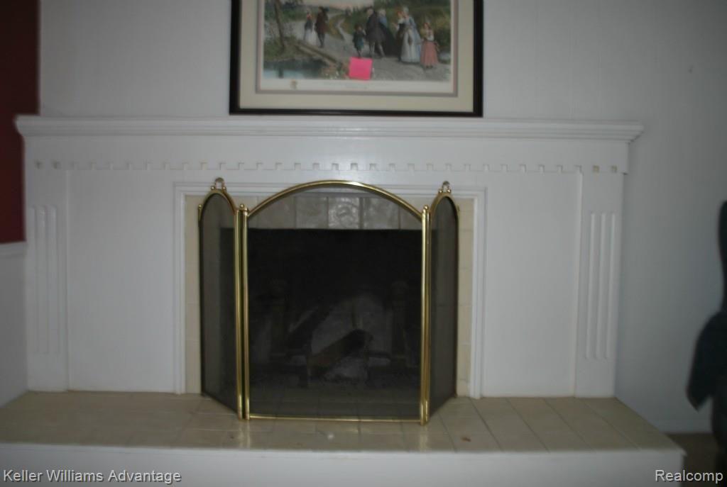 36554 West Lyman Road Farmington, MI 48331 - Photo 14 of 31 Natural fireplace with ceramic hearth