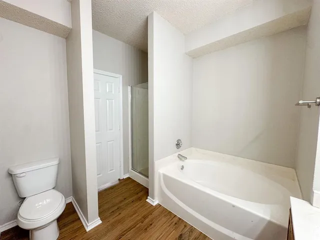 a white toilet sitting next to a bathroom sink