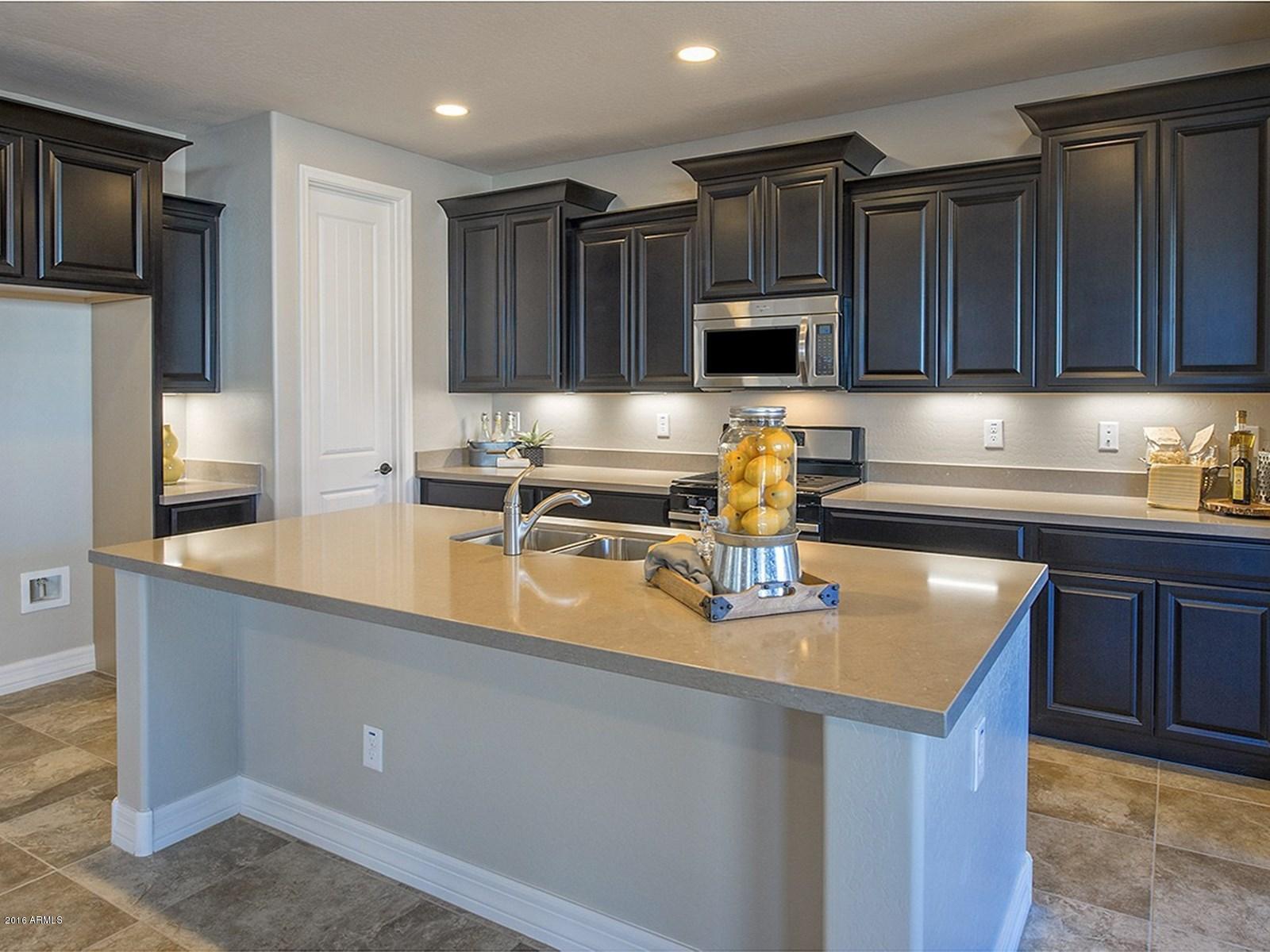 20654 West Stone Hill Road Buckeye, AZ 85396 - Photo 11 of 31 011_Staggered Cabinet wUnder Lights