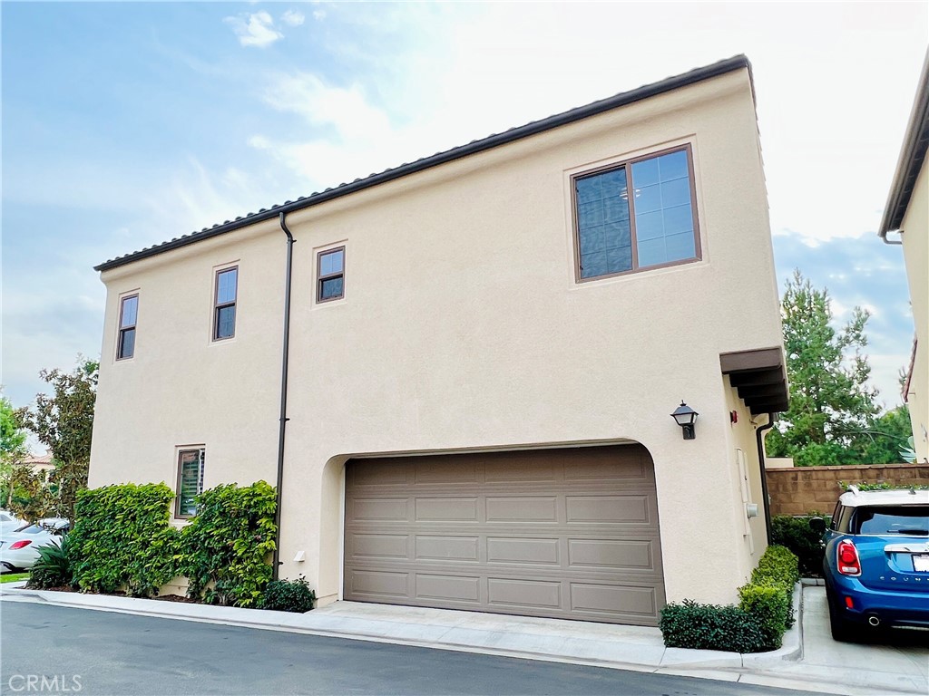 242 Firefly Irvine, CA 92618 - Photo 3 of 3 a view of a white house with a street