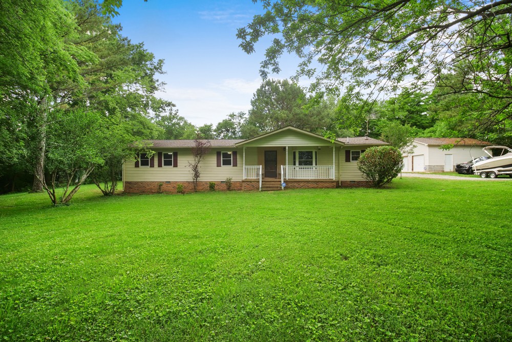 156 Vantrease Lane Gallatin, TN 37066 - Photo 1 of 37 a front view of a house with a yard table and chairs