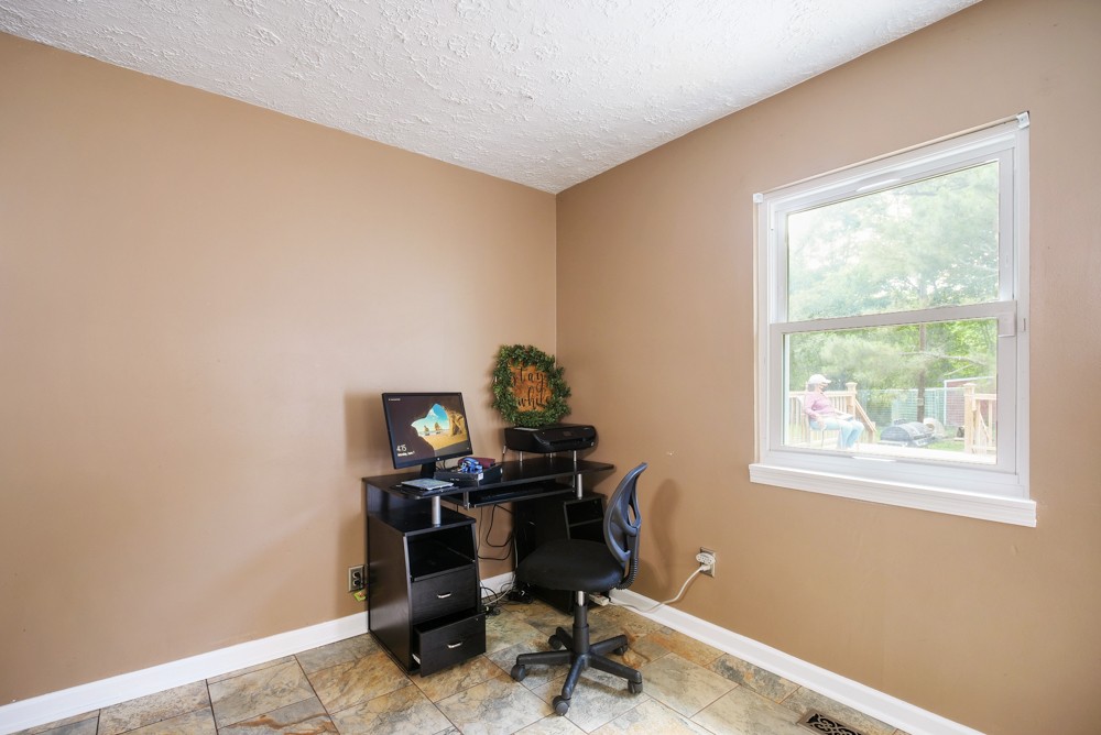 156 Vantrease Lane Gallatin, TN 37066 - Photo 19 of 37 a view of a workspace with furniture and a window