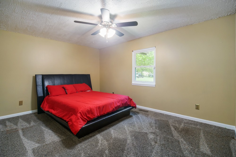 156 Vantrease Lane Gallatin, TN 37066 - Photo 20 of 37 a bedroom with a bed and window