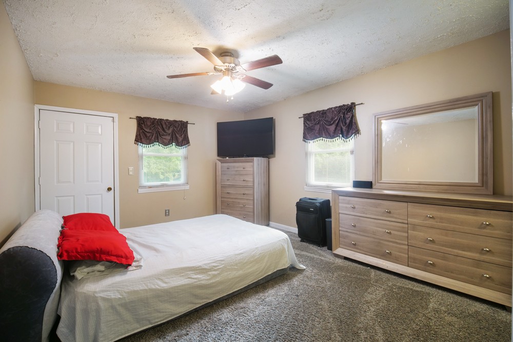 156 Vantrease Lane Gallatin, TN 37066 - Photo 21 of 37 a bedroom with a large bed and a window