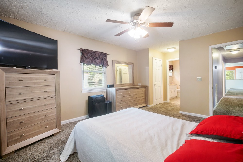 156 Vantrease Lane Gallatin, TN 37066 - Photo 24 of 37 a bedroom with a large bed and a tv