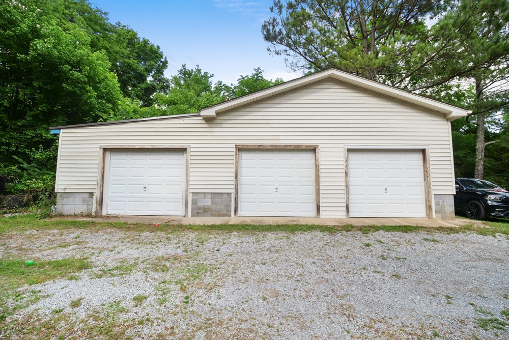 156 Vantrease Lane Gallatin, TN 37066 - Photo 32 of 37 a view of house with yard and garage