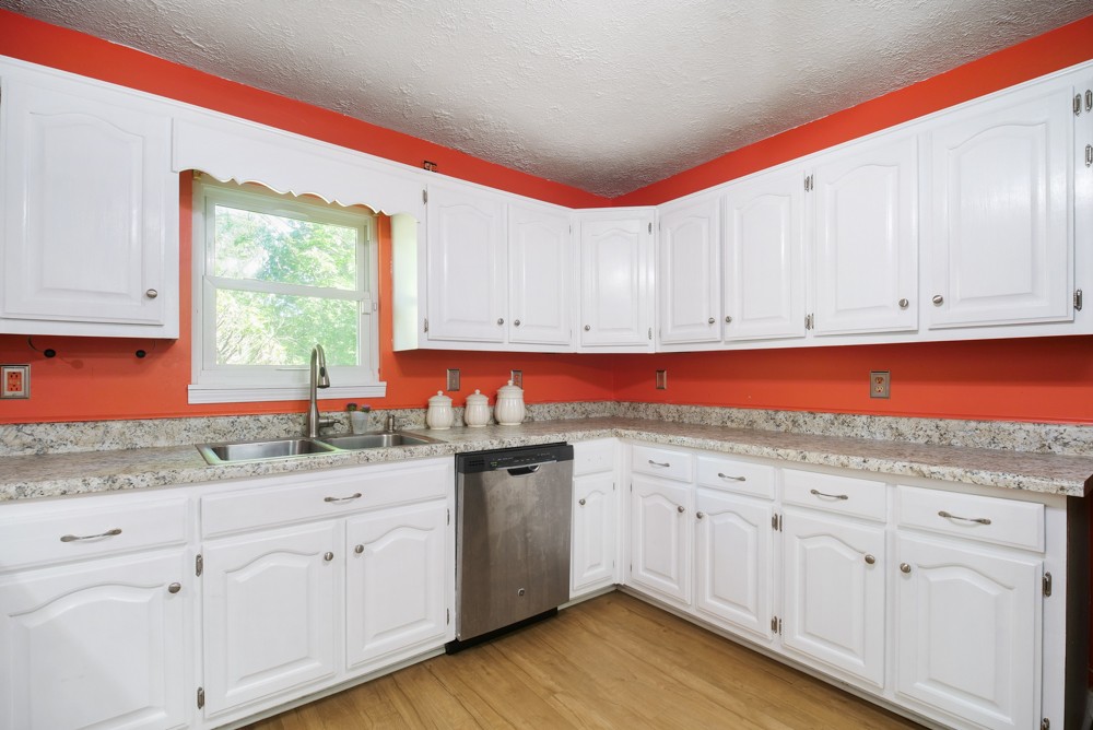 156 Vantrease Lane Gallatin, TN 37066 - Photo 8 of 37 a kitchen with white cabinets sink and window