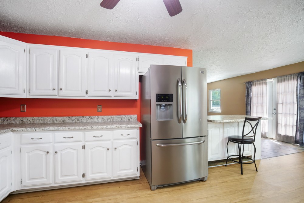 156 Vantrease Lane Gallatin, TN 37066 - Photo 9 of 37 a kitchen with stainless steel appliances granite countertop a refrigerator and a stove top oven