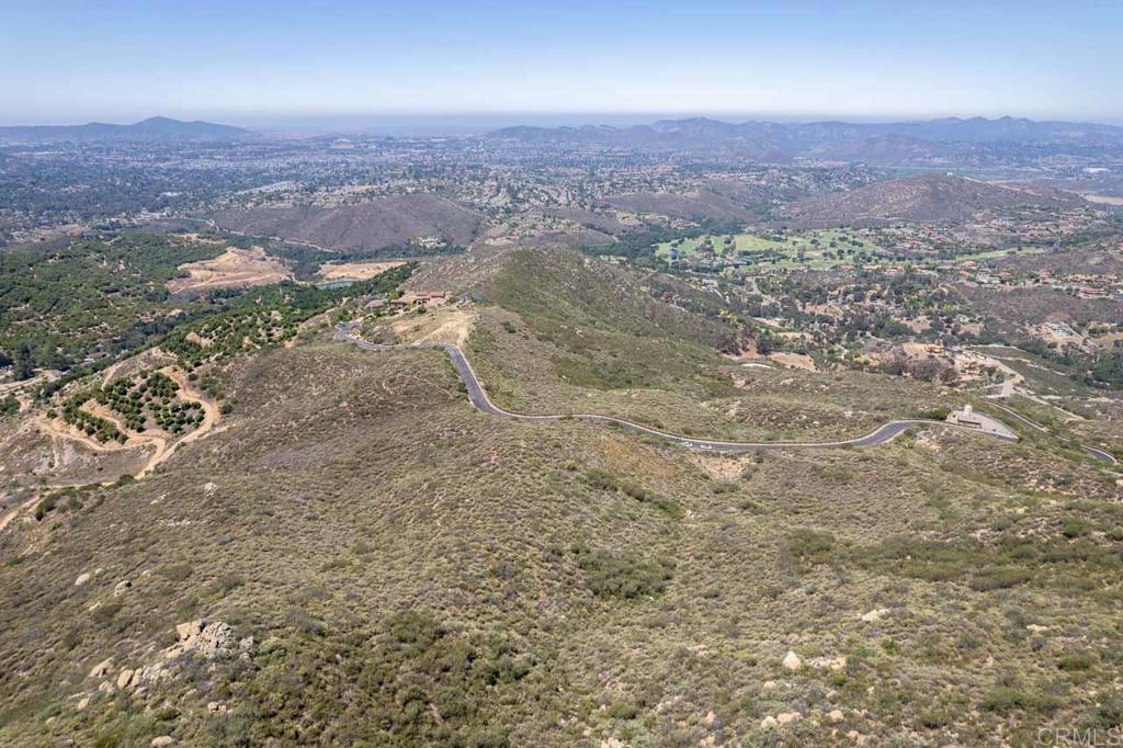 18055 Sunset Point Poway, CA 92064 - Photo 20 of 39 an aerial view of house with yard and mountain view in back