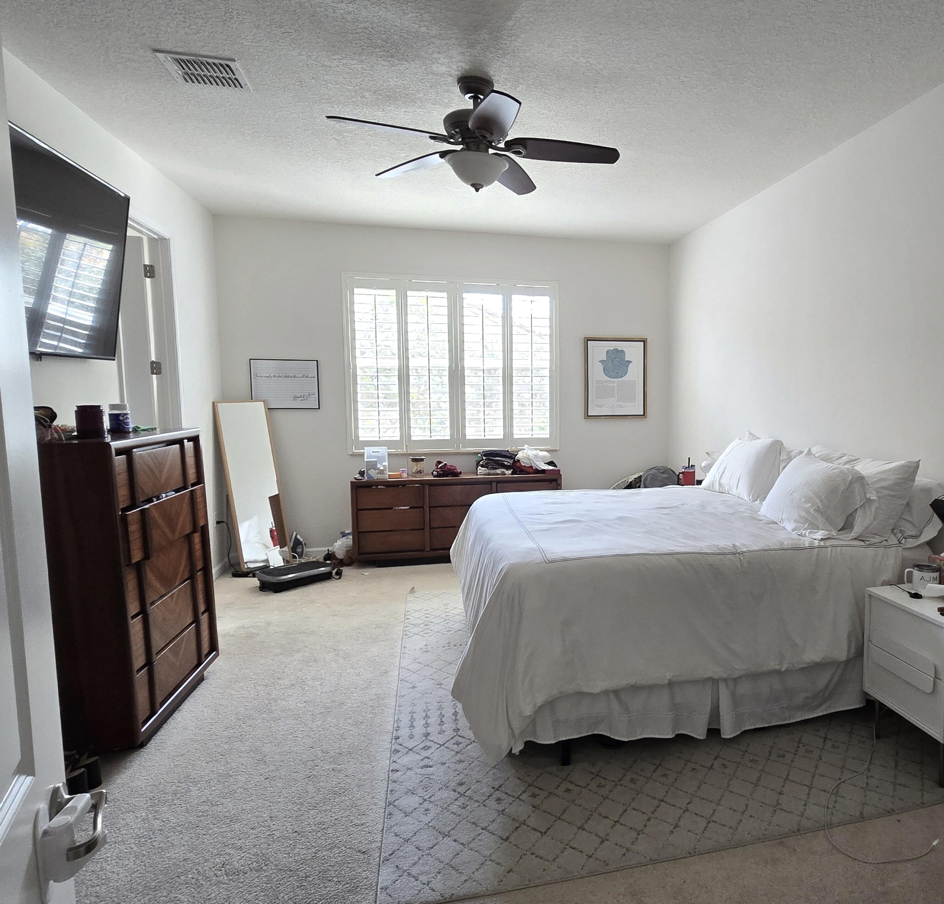 4820 Northwest 16th Terrace Boca Raton, FL 33431 - Photo 12 of 39 a bedroom with bed and window