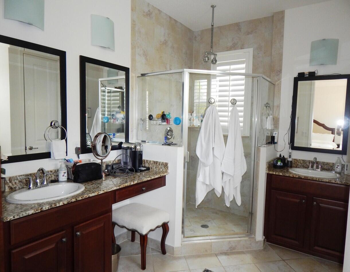 4820 Northwest 16th Terrace Boca Raton, FL 33431 - Photo 13 of 39 a bathroom with a granite countertop sink and a mirror