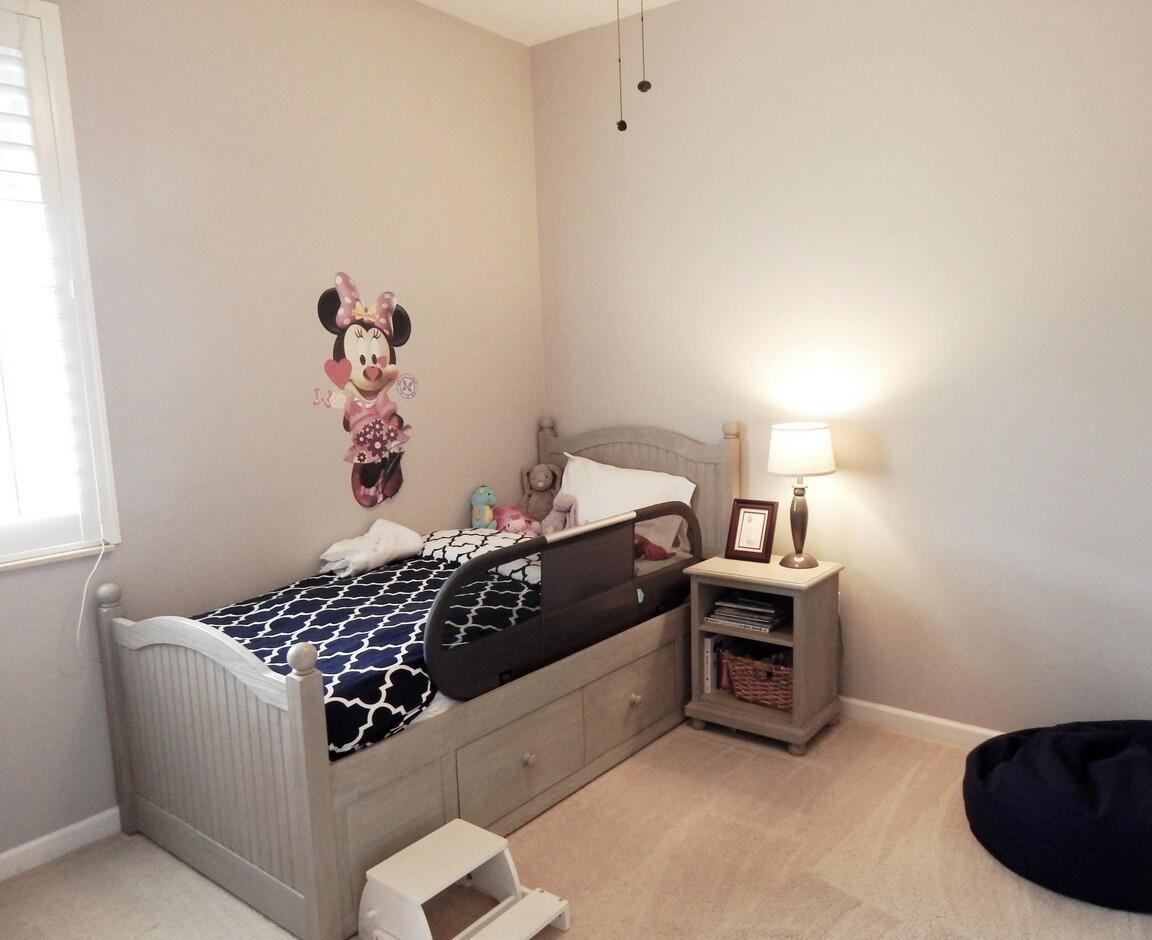 4820 Northwest 16th Terrace Boca Raton, FL 33431 - Photo 15 of 39 a bed room with a bed and a couch