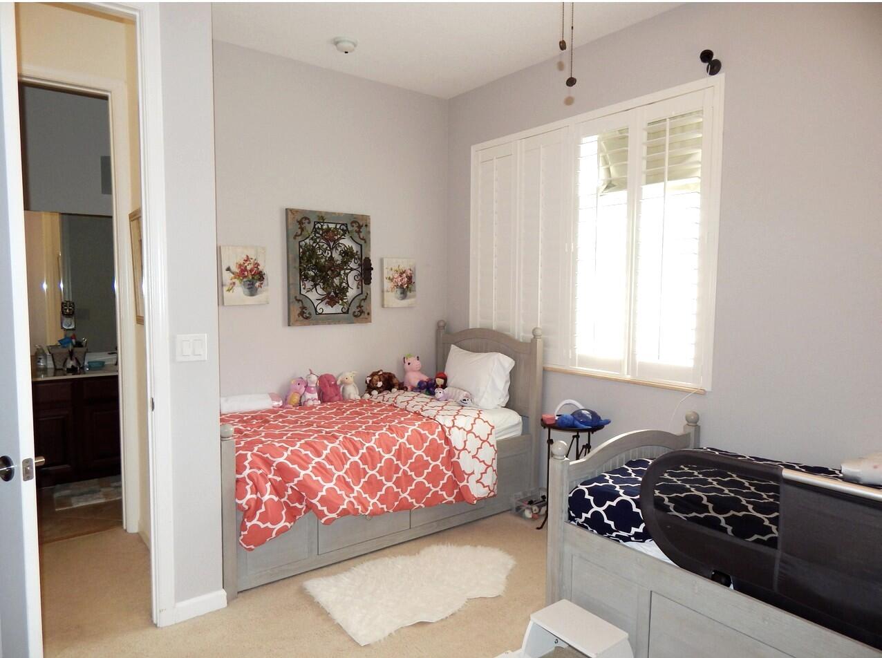 4820 Northwest 16th Terrace Boca Raton, FL 33431 - Photo 16 of 39 a bedroom with a bed and a window