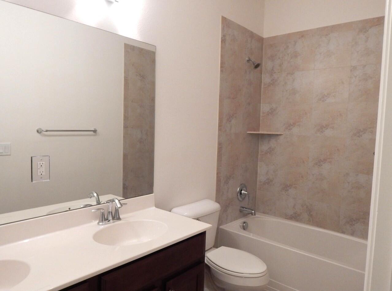 4820 Northwest 16th Terrace Boca Raton, FL 33431 - Photo 17 of 39 a bathroom with a sink toilet and shower