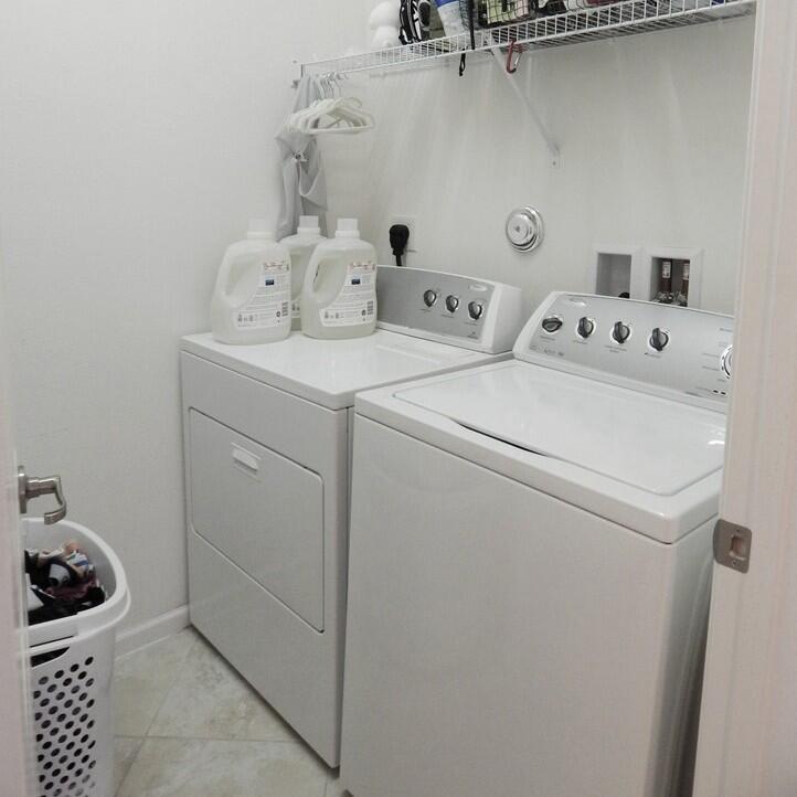 4820 Northwest 16th Terrace Boca Raton, FL 33431 - Photo 19 of 39 a utility room with dryer and washer